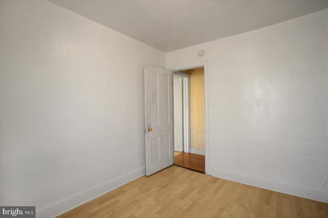 unfurnished room featuring light hardwood / wood-style flooring