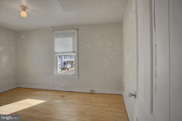 spare room with light hardwood / wood-style floors