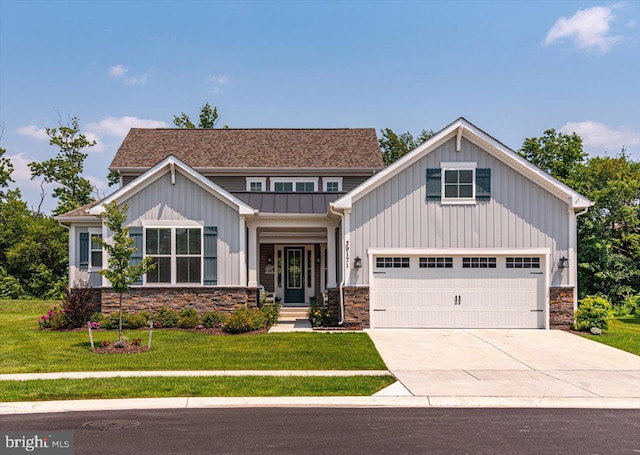 craftsman-style house featuring a garage and a front lawn