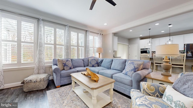 living room with crown molding, hardwood / wood-style flooring, and ceiling fan