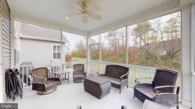 sunroom with plenty of natural light and ceiling fan