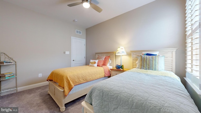 carpeted bedroom featuring high vaulted ceiling and ceiling fan