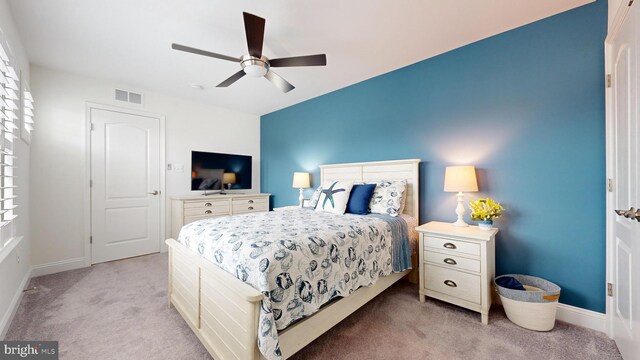 carpeted bedroom with ceiling fan