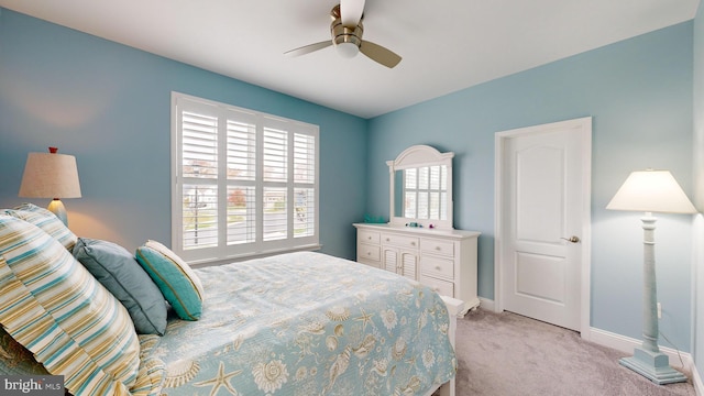 carpeted bedroom with ceiling fan