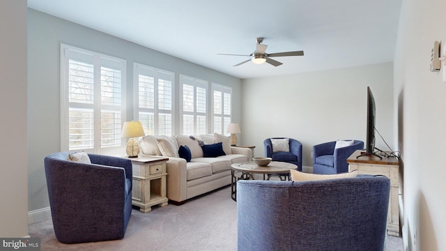 living room with light carpet and ceiling fan