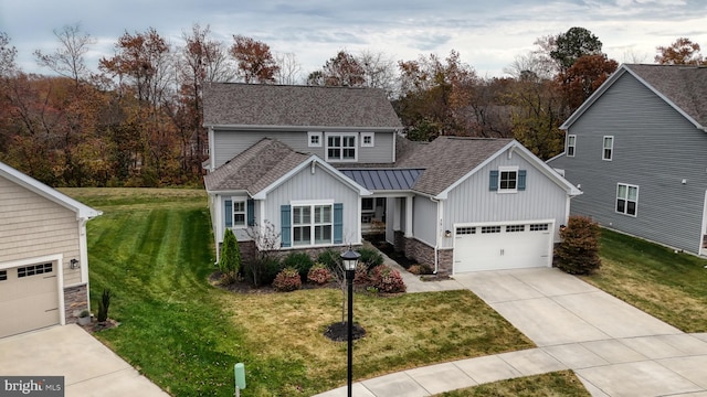 view of front of house featuring a front lawn and a garage