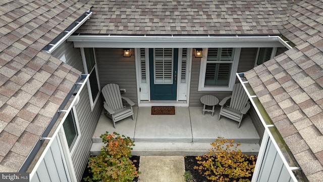 view of exterior entry featuring a porch