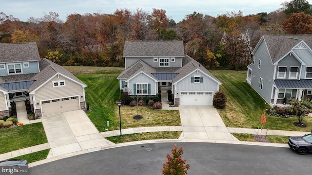 view of front of house with a front lawn and a garage