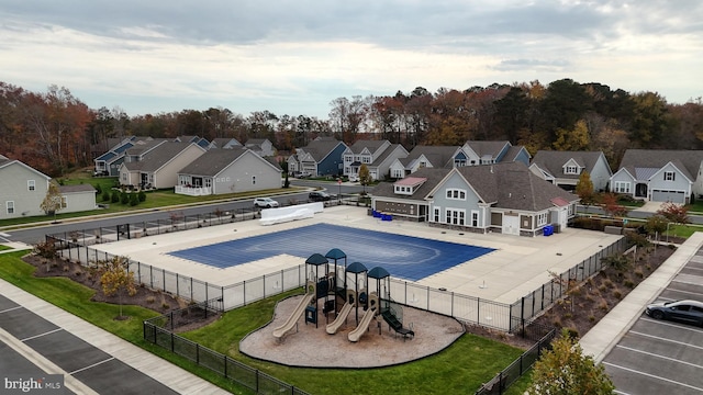 view of pool with a playground