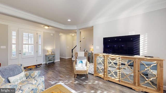 living room featuring hardwood / wood-style flooring and crown molding