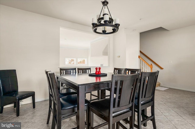 tiled dining space with a notable chandelier