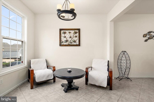 sitting room featuring a notable chandelier