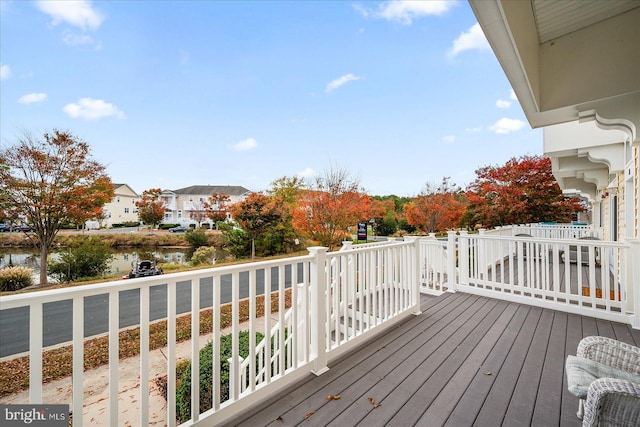 wooden deck with a water view