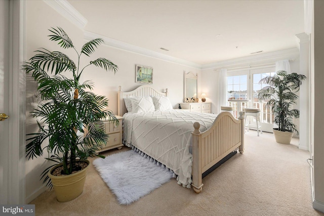 carpeted bedroom featuring ornamental molding