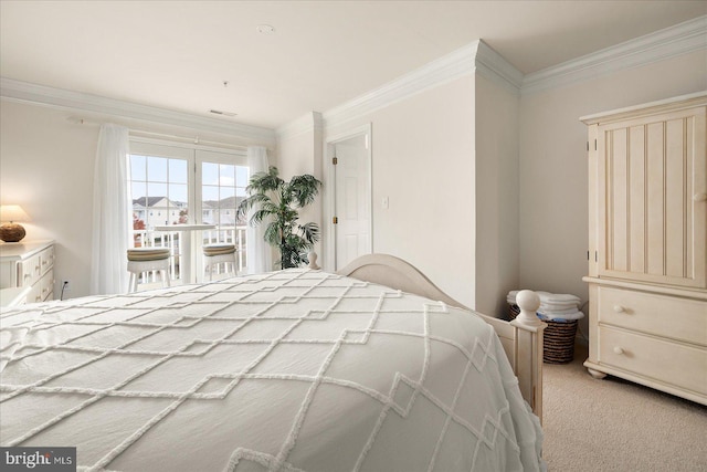 carpeted bedroom featuring ornamental molding