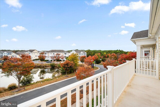 balcony featuring a water view