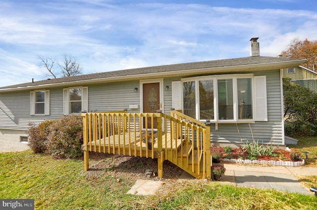 view of front facade featuring a wooden deck