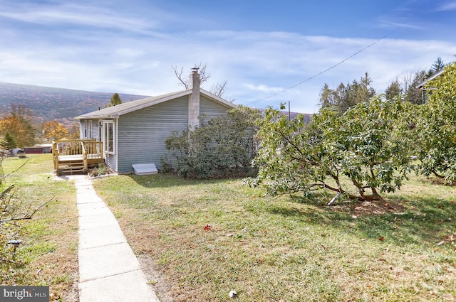 view of yard featuring a deck