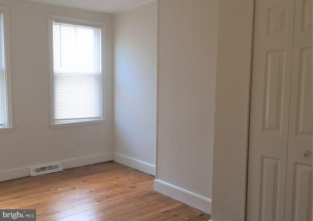 spare room with light hardwood / wood-style floors