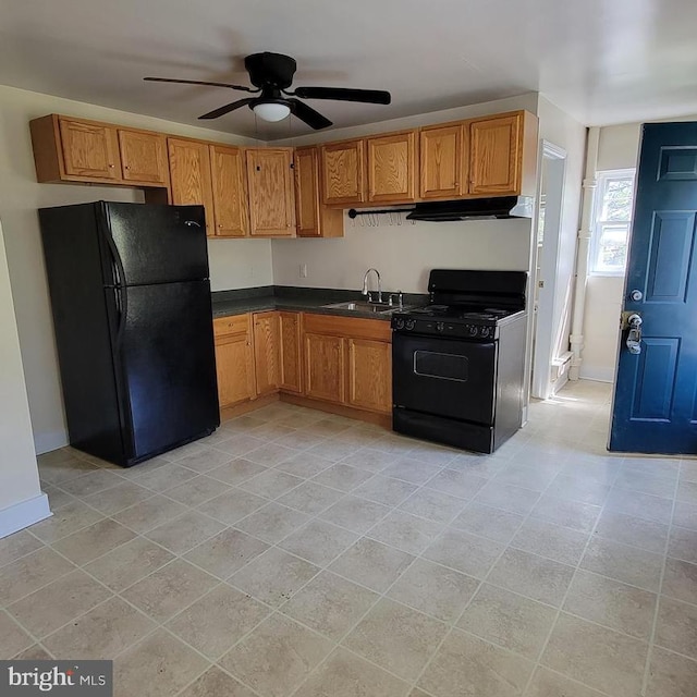 kitchen featuring light tile patterned flooring, sink, ceiling fan, and black appliances