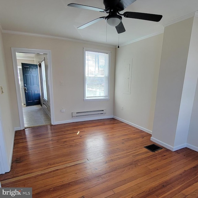 unfurnished room featuring ceiling fan, baseboard heating, light hardwood / wood-style flooring, electric panel, and crown molding