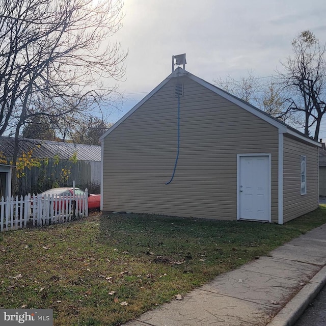 view of home's exterior with a yard