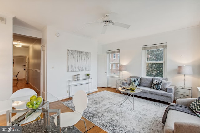 living room featuring hardwood / wood-style flooring and ceiling fan