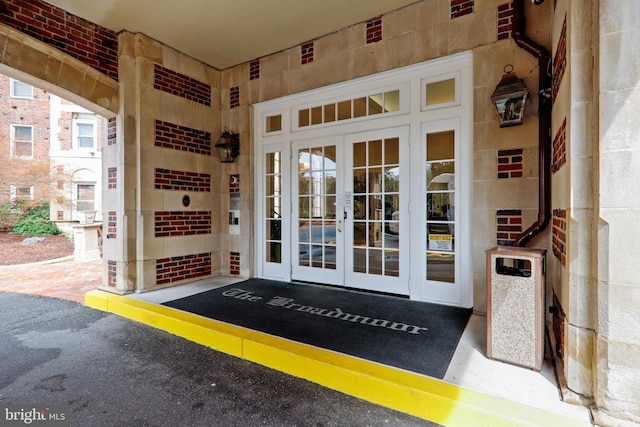 view of exterior entry featuring french doors