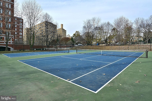 view of tennis court featuring basketball court