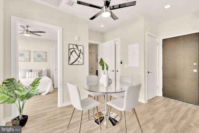 dining area featuring light hardwood / wood-style floors and ceiling fan