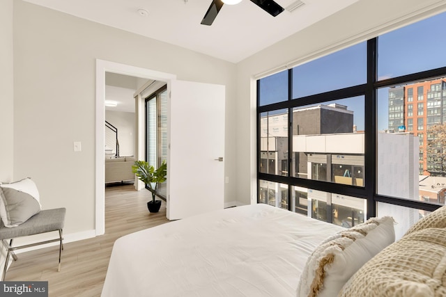 bedroom featuring ceiling fan and light wood-type flooring