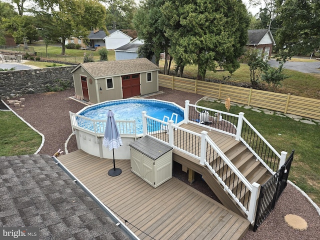 view of swimming pool with a deck and a storage unit