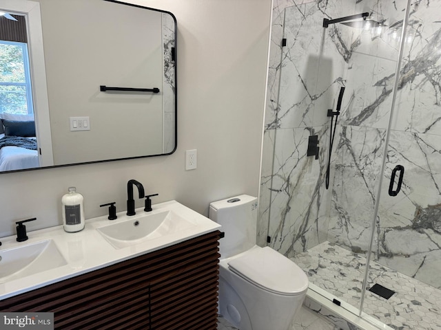 bathroom featuring walk in shower, vanity, and toilet