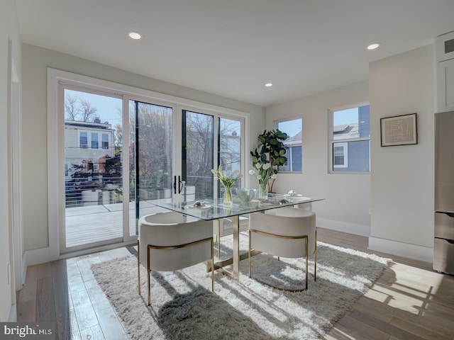 dining space with light wood-type flooring