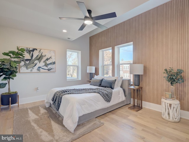 bedroom featuring ceiling fan and light hardwood / wood-style flooring