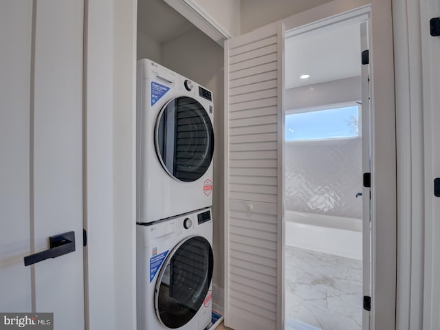 washroom with stacked washer and clothes dryer