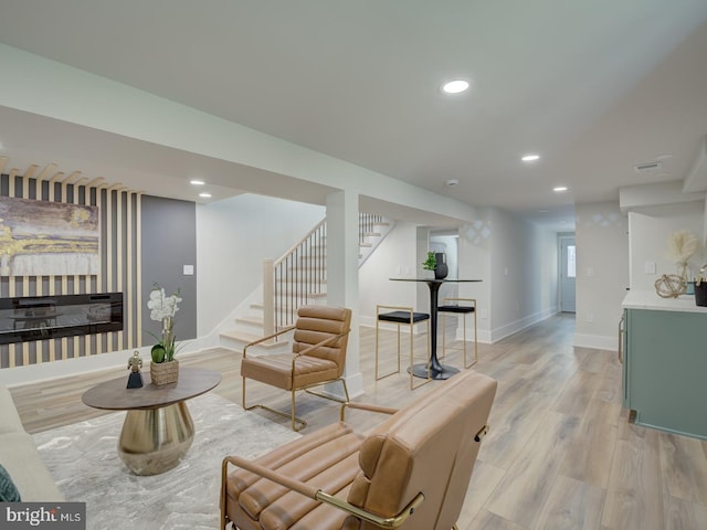 living room with light hardwood / wood-style floors