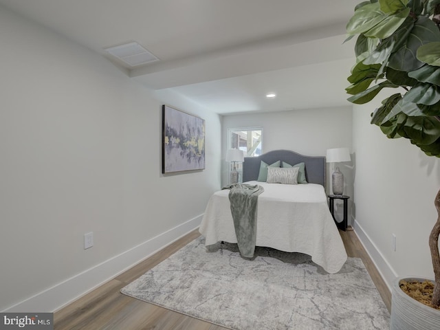 bedroom featuring hardwood / wood-style floors