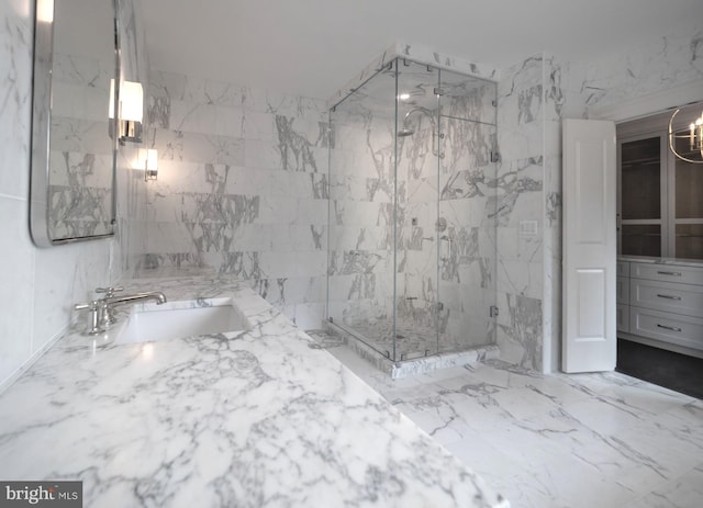 bathroom with vanity, tile walls, and walk in shower