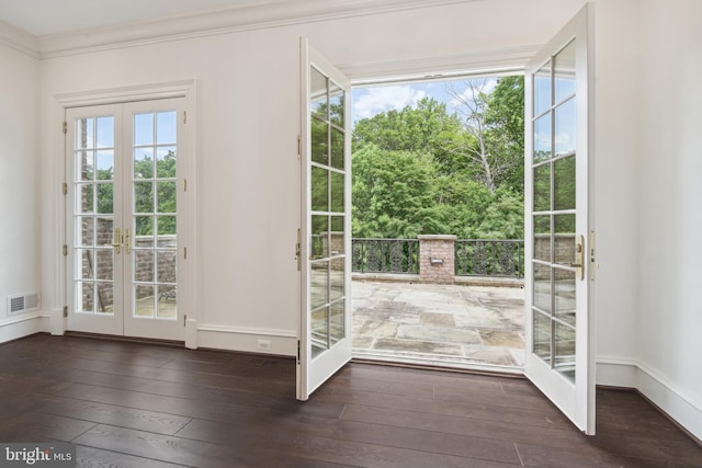 doorway to outside featuring french doors, dark hardwood / wood-style floors, and ornamental molding