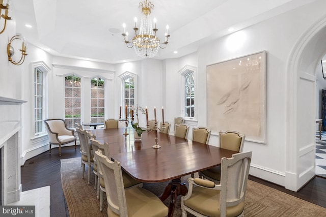 4825 Dexter Ter NW, Washington, DC 20007 - dining room with recessed lighting, arched walkways, a chandelier, a fireplace, and baseboards
