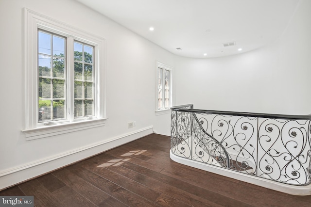 hallway with dark wood-type flooring