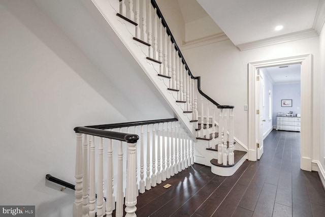 4825 Dexter Ter NW, Washington, DC 20007 - stairway with ornamental molding, wood finished floors, and baseboards