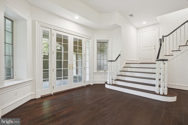 foyer with french doors and dark wood-type flooring