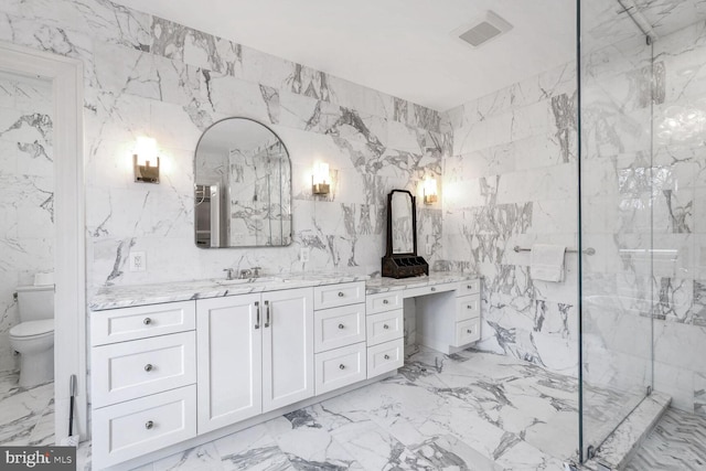 4825 Dexter Ter NW, Washington, DC 20007 - full bathroom featuring vanity, marble finish floors, tile walls, and toilet