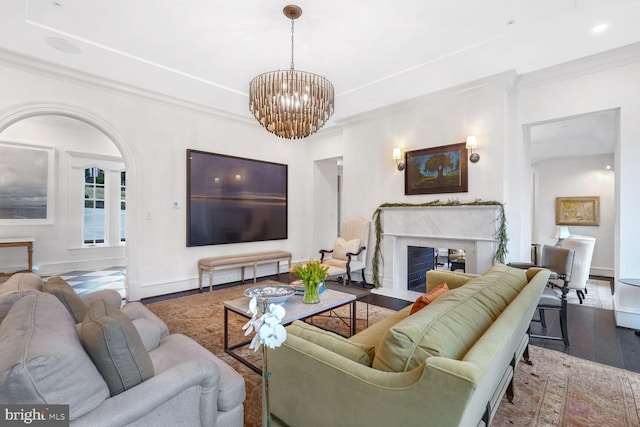 4825 Dexter Ter NW, Washington, DC 20007 - living area featuring wood finished floors, a chandelier, baseboards, crown molding, and a fireplace