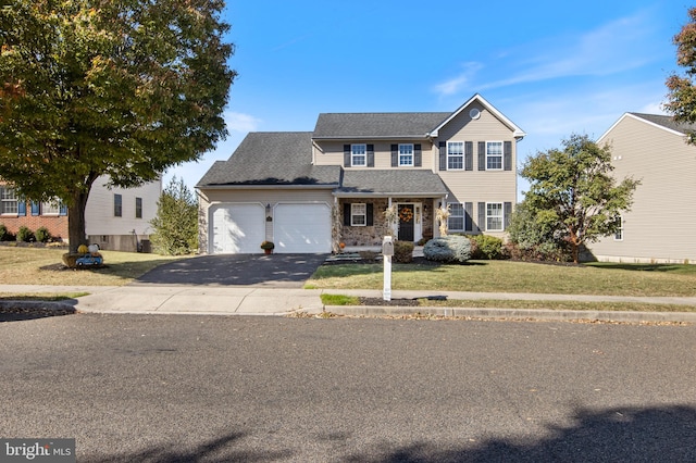 view of front facade featuring a garage and a front yard