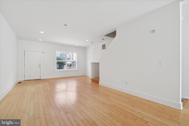 unfurnished living room with light wood-type flooring