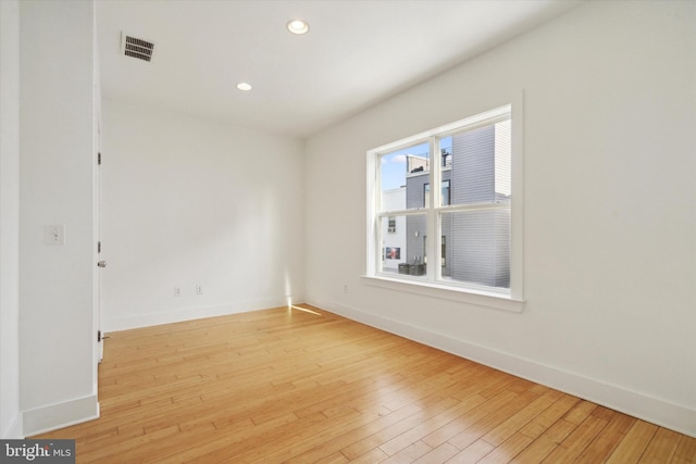 spare room featuring light hardwood / wood-style flooring