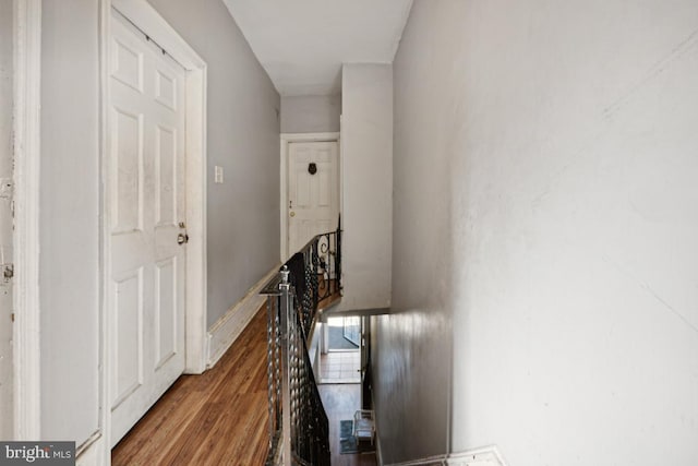 hall with wood-type flooring